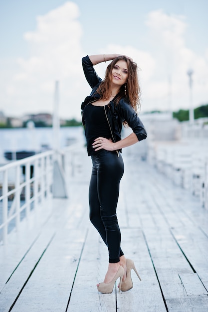 Full length portrait of gorgeous sexy brunette girl an black attractive dress