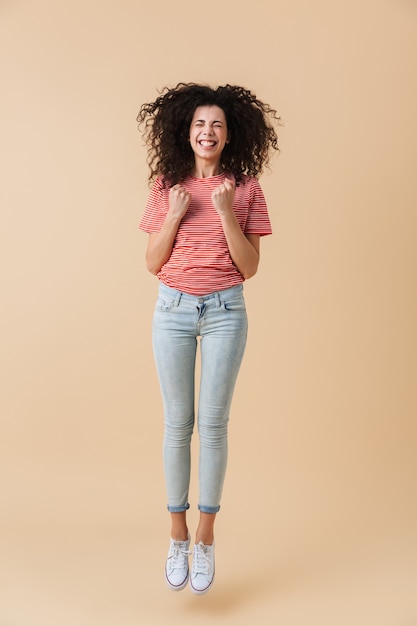 Full length portrait of a happy young woman