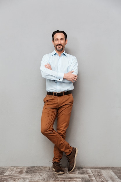 Full length portrait of a mature man dressed in shirt