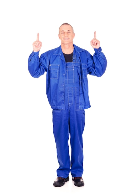 Photo full length portrait of mechanic pointing against white background