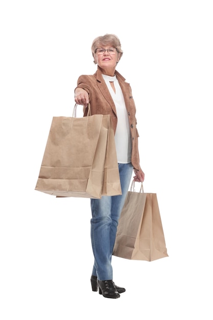 Full length portrait of a Senior woman walking with shopping bags