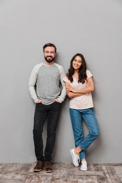 Full length portrait of a smiling young couple