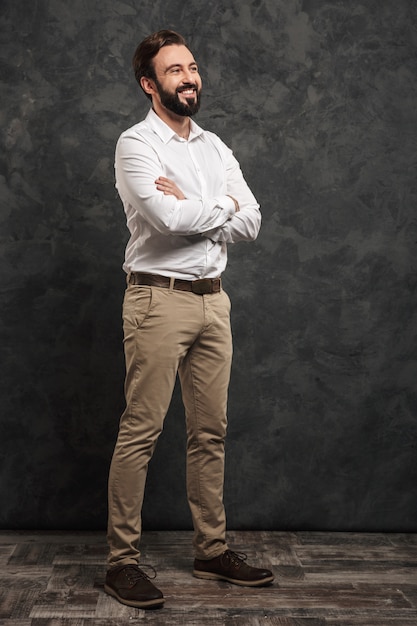 Full length portrait of a smiling young man