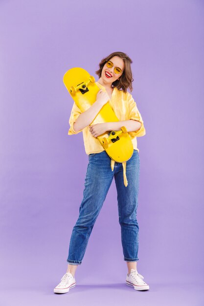 Full length portrait of a smiling young woman