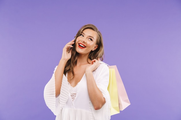 Full length portrait of a smiling young woman