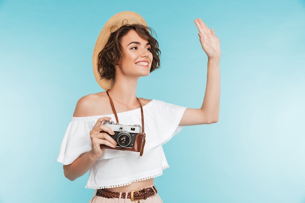 Full length portrait of a smiling young woman