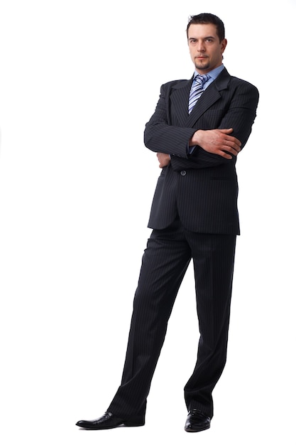 Full length portrait of a successful mature business man with hands folded isolated on white