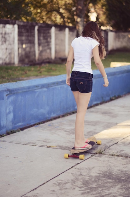 full length rear view of teenage girl