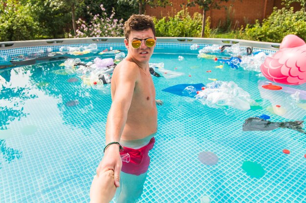 Full length of shirtless boy in swimming pool