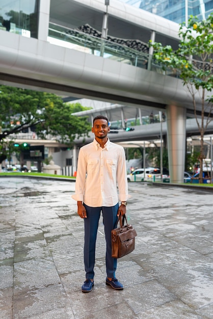 Full length shot of black man outdoors in city