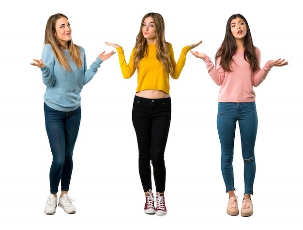 A full-length shot of a group of people with colorful clothes having doubts 