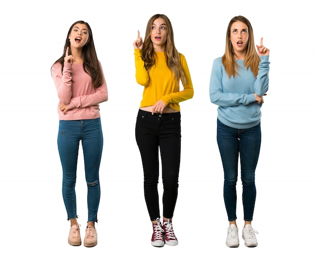 A full-length shot of a group of people with colorful clothes thinking an idea pointing 