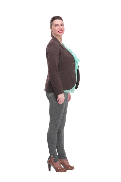 Full length side view of a confident young business woman standing with folded hands