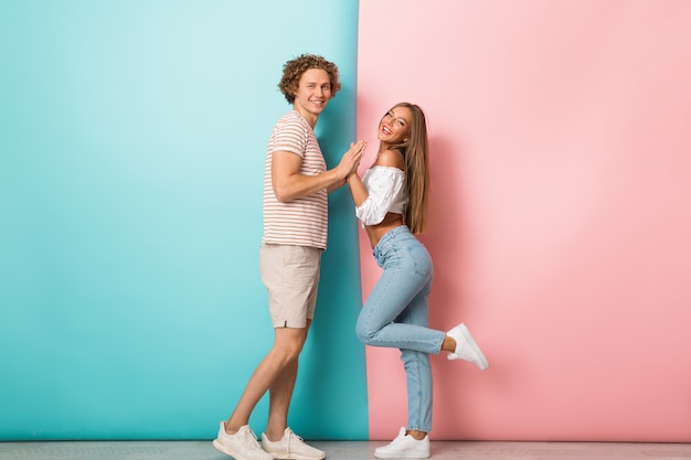 Full length of smiling young couple