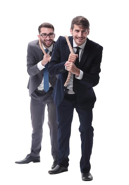 Full length two businessmen pulling a long rope