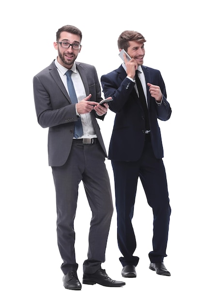 Full length two businessmen using their smartphones