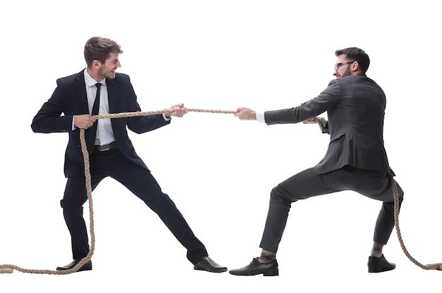 Photo full length two smiling businessmen pulling the rope