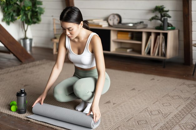 Full length of woman exercising in gym