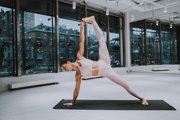 Full length of woman exercising at gym