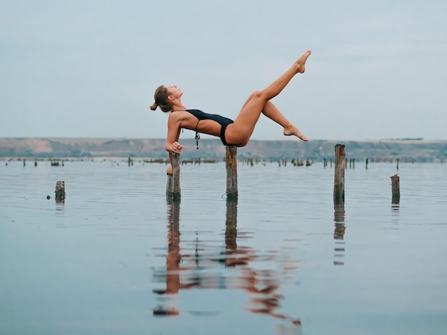 full length of woman exercising outdoors