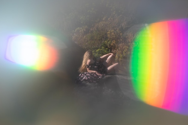 Photo full length of woman lying down on rock