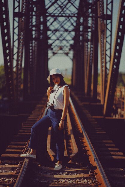 Photo full length of woman on railroad track