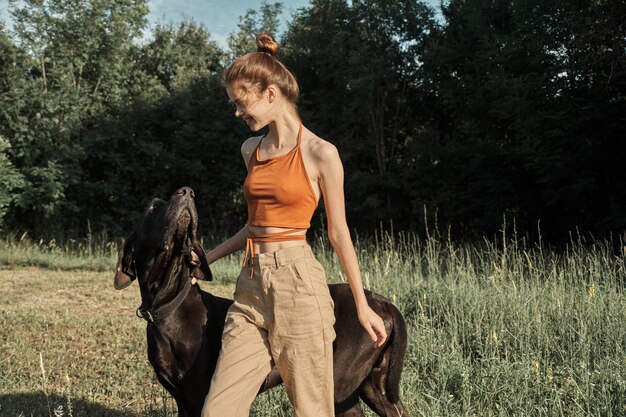 Photo full length of woman riding dog on plants