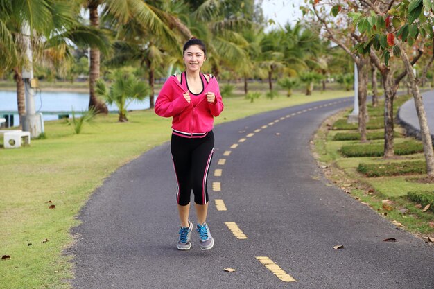 Photo full length of woman running on road