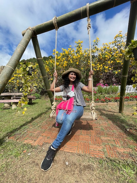 Photo full length of woman sitting on swing