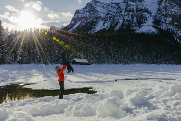 Full length of woman skiing on snow covered mountain