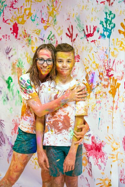 Photo full length of woman standing against multi colored wall