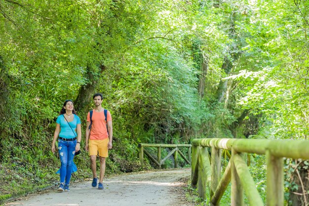 Photo full length of woman standing on footbridge