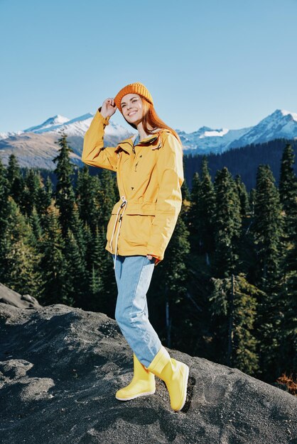 Full length of woman standing on mountain