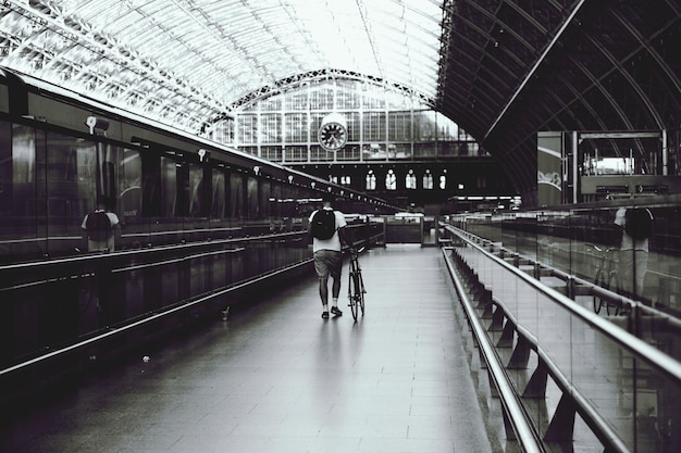 Full length of woman standing on railing