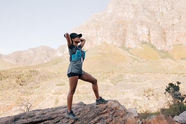 Full length of woman standing on rock