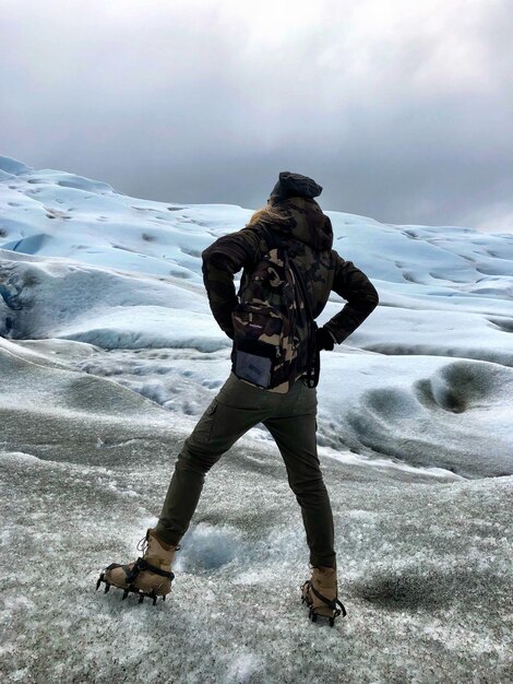 Full length of woman standing on snow