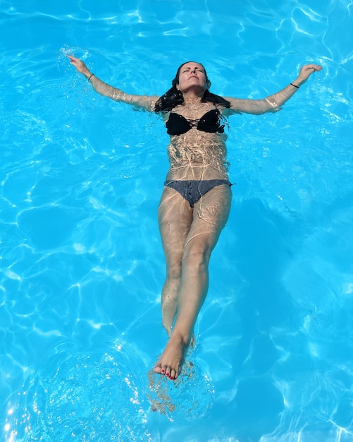 Full length of woman in swimming pool