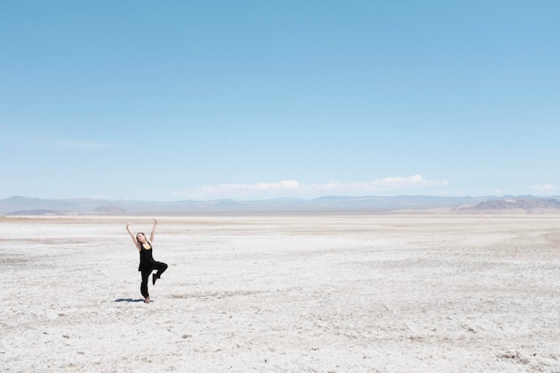 Full length of a woman walking in desert