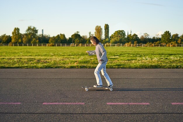 Full length of woman walking on road