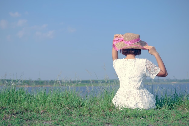 Full length of woman wearing hat on field against sky