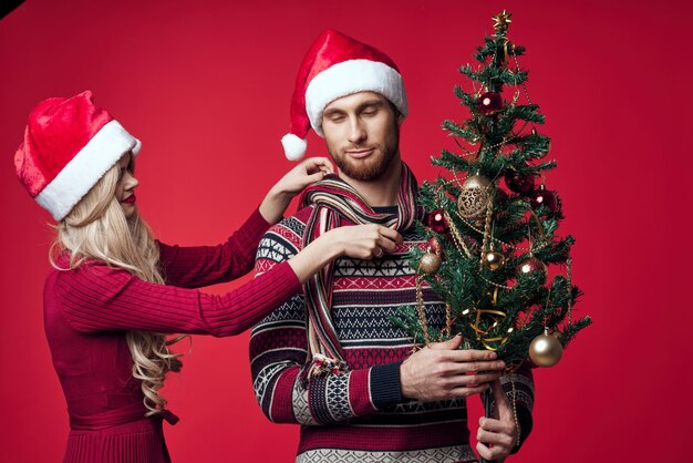 Full length of woman with christmas tree