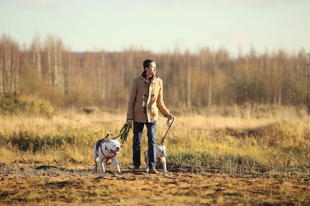 full length of woman with dog on field