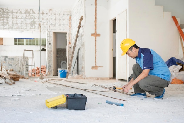 Full length of worker working at construction site