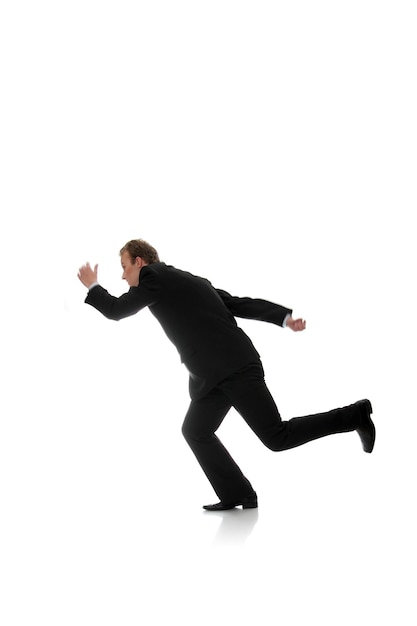 Photo full length of young man running against white background