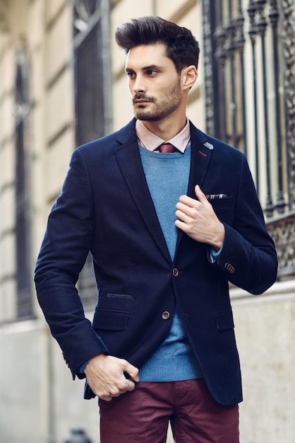 full length of young man standing against wall
