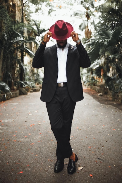 Full length of young man wearing hat standing on road