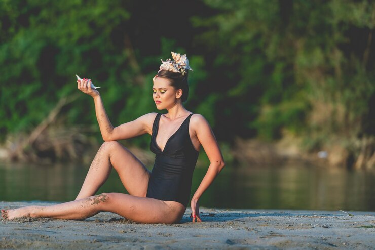 Photo full length of young woman in lake
