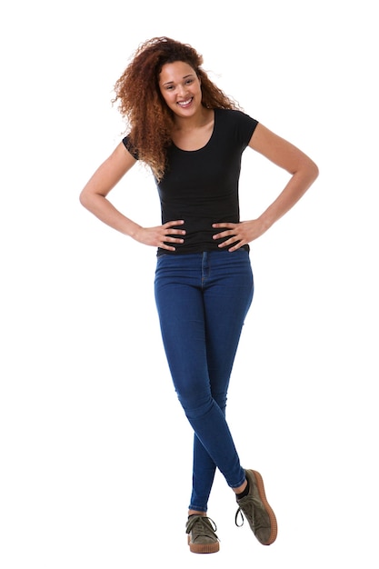 Full length young woman smiling against isolated white background