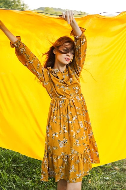 Full length of young woman standing on field