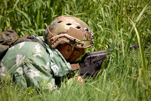 Full military experience One day commando running through the water with automatic rifle replica